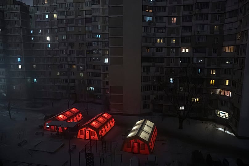 Emergency tents are set up in a residential neighbourhood where people can warm up following Russia's air attacks in Kyiv, 15 January, 2026