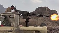 A Houthi fighter firing a vehicle-mounted machine gun at Saudi-backed forces in Yemen, 22 September, 2026