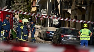 Firefighters work at the scene following a powerful blast that caused a building to collapse in Athens, 25 September, 2026