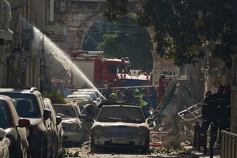 Firefighters work at the scene following a powerful blast that caused a building to collapse in Athens, 25 September, 2026