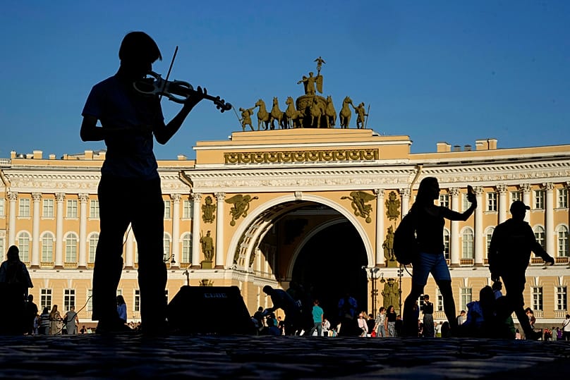 A man plays the violin to earn money at the Palace Square in St. Petersburg, 10 July, 2024