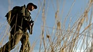 A Turkish soldier patrols the area near the Turkey-Iraq border, in the province of Sirnak, Tuesday, Oct. 23, 2007.