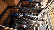 FILE: Archaeological workers wearing hard hats dig 4 meters underground during excavations outside Notre-Dame Cathedral in Paris