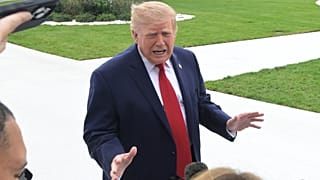 President Donald Trump talks with reporters on the South Lawn of the White House before boarding Marine One, Saturday, Sept. 26, 2026, in Washington. (AP Photo/Rod Lamkey, Jr.