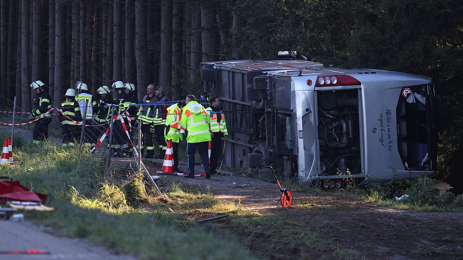 Emergency services at the scene after a tourist bus veered off a highway, in Buchloe, Germany, Sunday, Sept. 27, 2026.