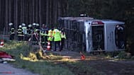Emergency services at the scene after a tourist bus veered off a highway, in Buchloe, Germany, Sunday, Sept. 27, 2026.