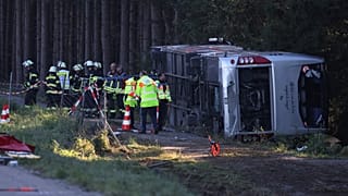 Emergency services at the scene after a tourist bus veered off a highway, in Buchloe, Germany, Sunday, Sept. 27, 2026.