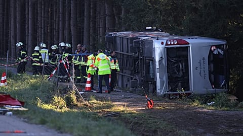 Emergency services at the scene after a tourist bus veered off a highway, in Buchloe, Germany, Sunday, Sept. 27, 2026.