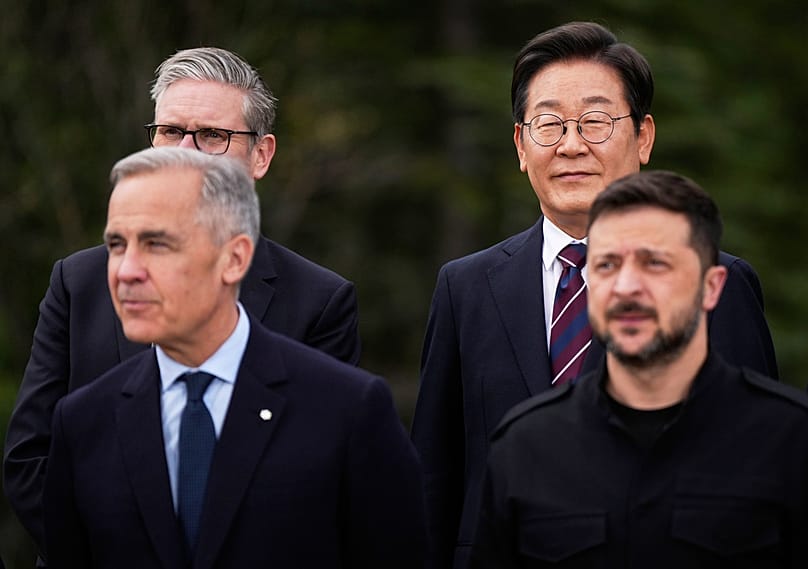 Lee Jae-myung and Volodymyr Zelenskyy pose for photos alongside Canada's Carney and UK's Starmer at the G7 Summit in Alberta, Canada, Tuesday, June 17, 2025
