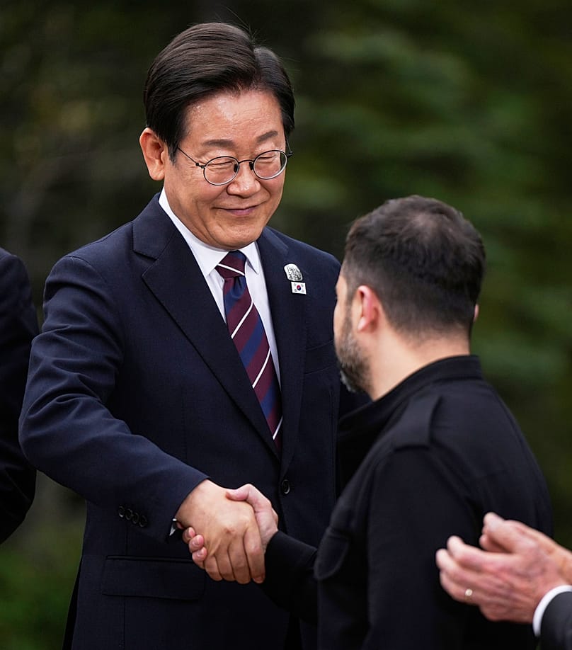 South Korean President Lee Jae-myung shakes hands with Ukraine's President Zelenskyy after posing for photos at the G7 Summit in Alberta, Canada, Tuesday, June 17, 2025