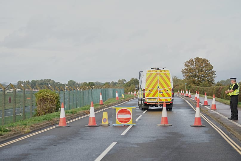 Police stand at a road block on the road to RAF Fairford after an incident in Whelford, 27 September, 2026