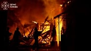 Firefighters are extinguishing a fire after a drone strike in Kyiv