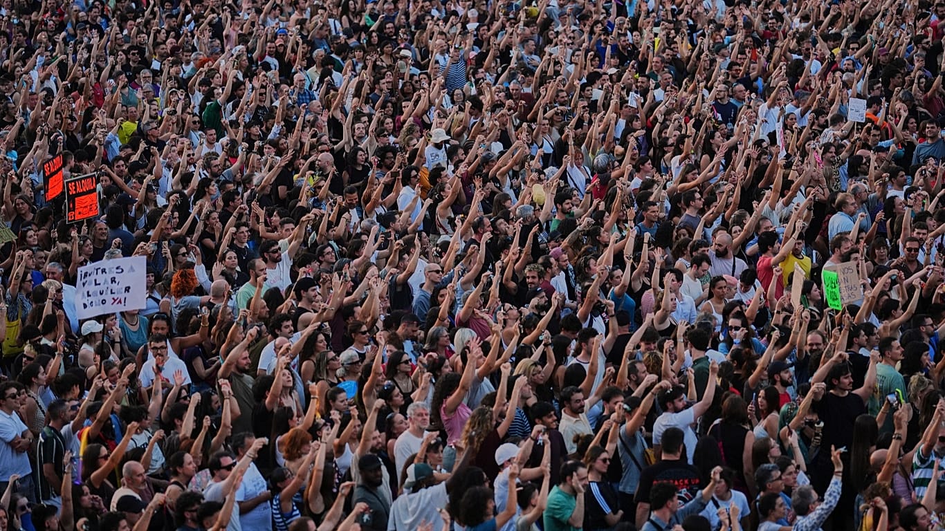 People gather during a protest following the eviction of 87-year-old Maricarmen in Madrid, 26 September, 2026
