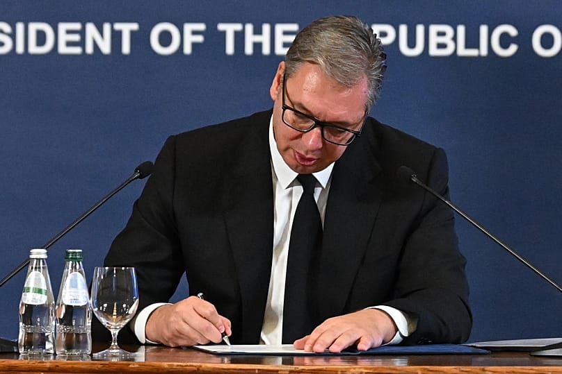 Serbian President Aleksandar Vučić signing his resignation in Belgrade, 27 September, 2026