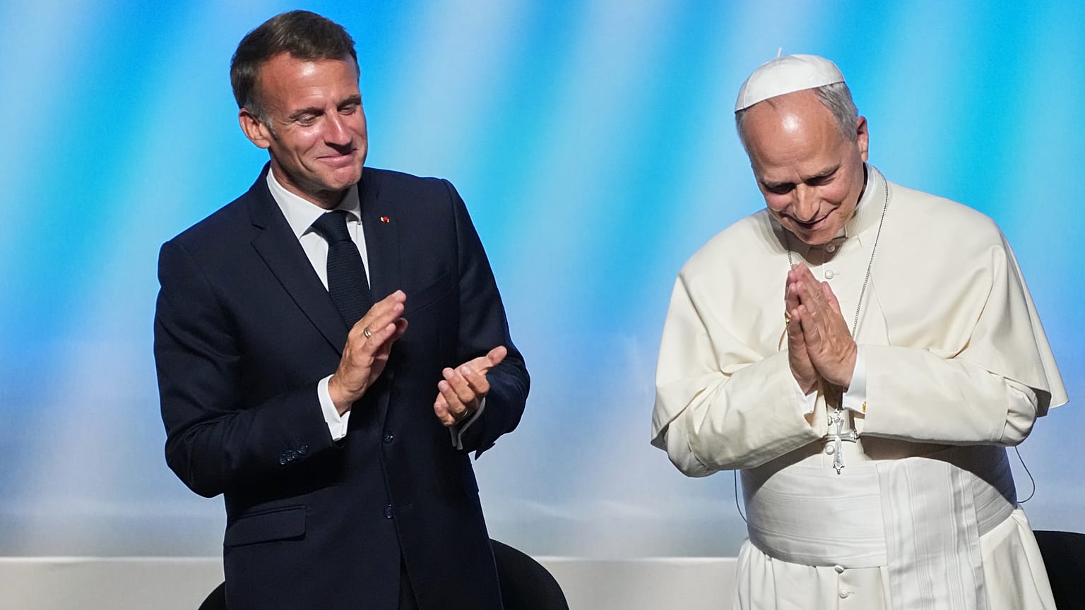 Pope Leo XIV is congratulated by French President Emmanuel Macron, left, after his speech at the meeting At the Roots of Europe for Peace and Unity with, 28 September 2026.