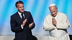 Pope Leo XIV is congratulated by French President Emmanuel Macron, left, after his speech at the meeting At the Roots of Europe for Peace and Unity with, 28 September 2026.