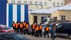 FILE: Prisoners under escort leave prison to work at a prison colony in Krasnoyarsk, 20 December 2013