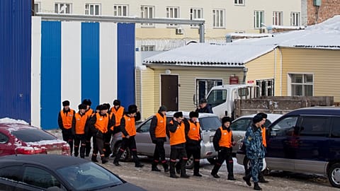 FILE: Prisoners under escort leave prison to work at a prison colony in Krasnoyarsk, 20 December 2013