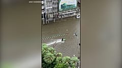 Jet ski rider cruises through flooded streets of Bangkok