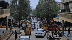 People walk in Mekelle, the capital of Ethiopia's Tigray region, as fighting escalates with the central government, 24 September 2026