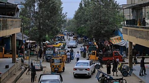 People walk in Mekelle, the capital of Ethiopia's Tigray region, as fighting escalates with the central government, 24 September 2026