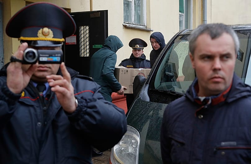 Belarusian Interior Ministry officer films journalists near the Belsat Channel during a search of the broadcaster’s office in Minsk, Belarus, on 21 March, 2017.