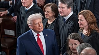 FILE - President Trump walks past US Supreme Court justices as he arrives for his State of the Union address, at the Capitol in Washington, Tuesday, Feb. 24, 2026