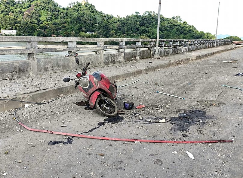 A damaged motorcycle seen on a bridge after a market in an adjacent area was allegedly hit by the military’s airstrike in Kyauktaw, Rakhine, Myanmar, Monday, Sept.28, 2026