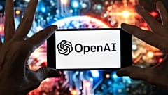 FILE - The OpenAI logo is displayed on a cell phone in front of an image generated by ChatGPT's Dall-E text-to-image model, Dec. 8, 2023, in Boston