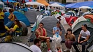 Protesters camp during a protest at Sol Square following the eviction last Wednesday of 87-year-old Maricarmen as they demand stronger laws to protect renters in Madrid.