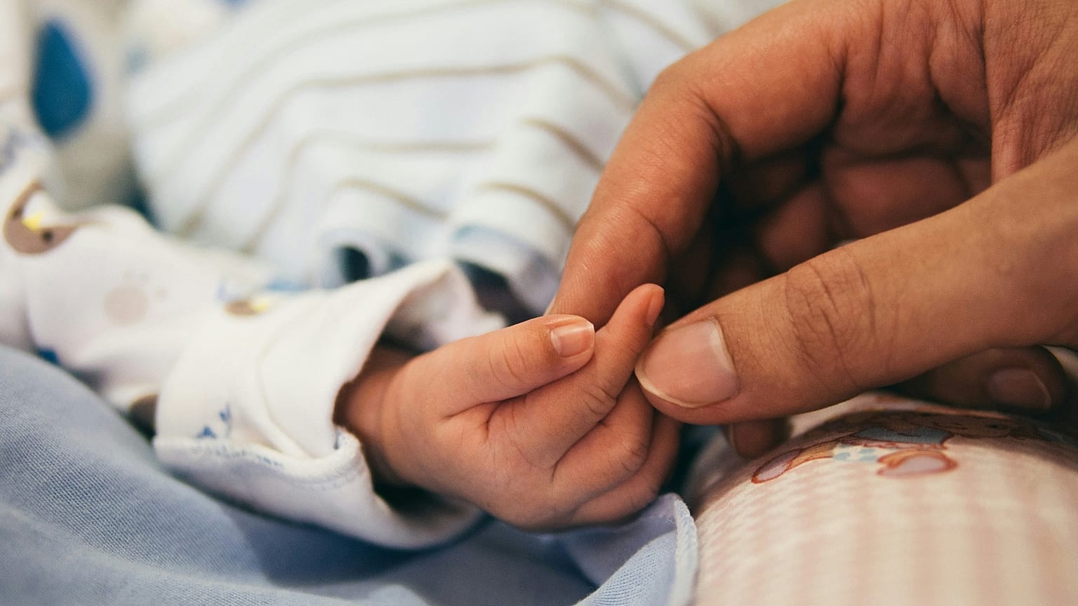 A person holding a baby's hand, 2 August, 2016