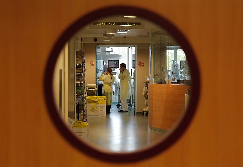 Doctors visit a patient at the intensive care unit of the Queen Fabiola Children's Hospital in Brussels, 25 November, 2013