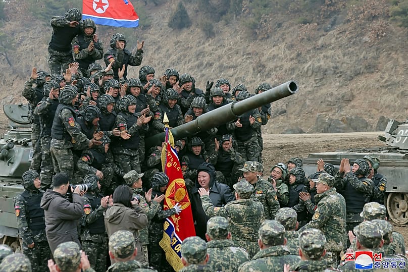 North Korean leader Kim Jong-un meets soldiers who took part in a training in North Korea, 13 March, 2024