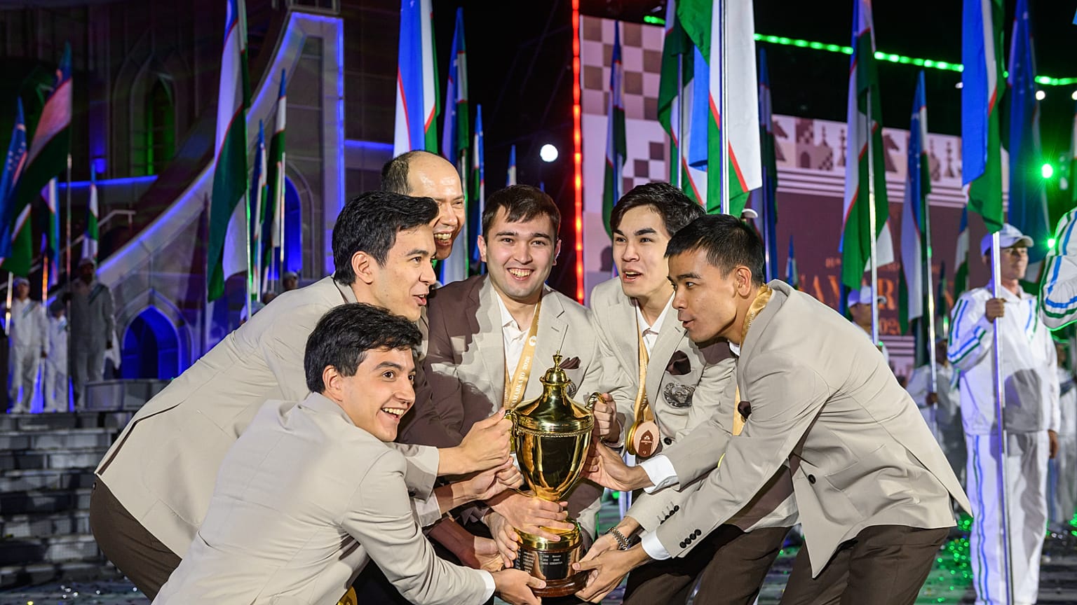 Uzbekistan’s chess team celebrates winning Open gold in Samarkand.