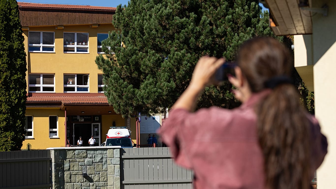 An ambulance parked next to the entrance to the primary school building following a stabbing attack by a pupil in Staskov, 29 September, 2026