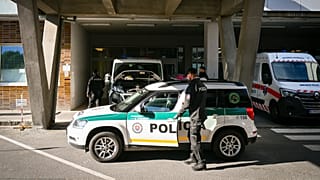 A police car parked outside the F. D. Roosevelt University Hospital in Banska Bystrica, 16 May, 2024