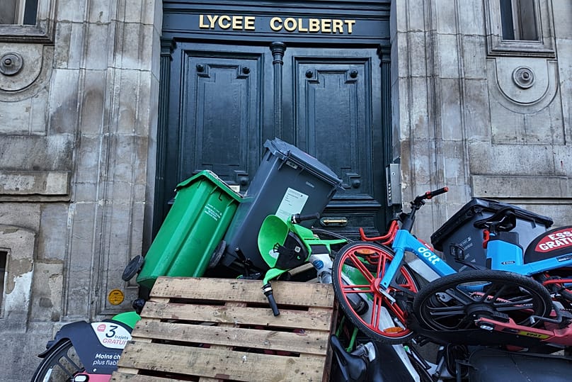 The entrance to Colbert High School is blocked in protest of the government's release of next year's draft budget in Paris, 29 September, 2026