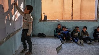 Nearly two years after the fall of Assad, Syrian children return to school amid ruins