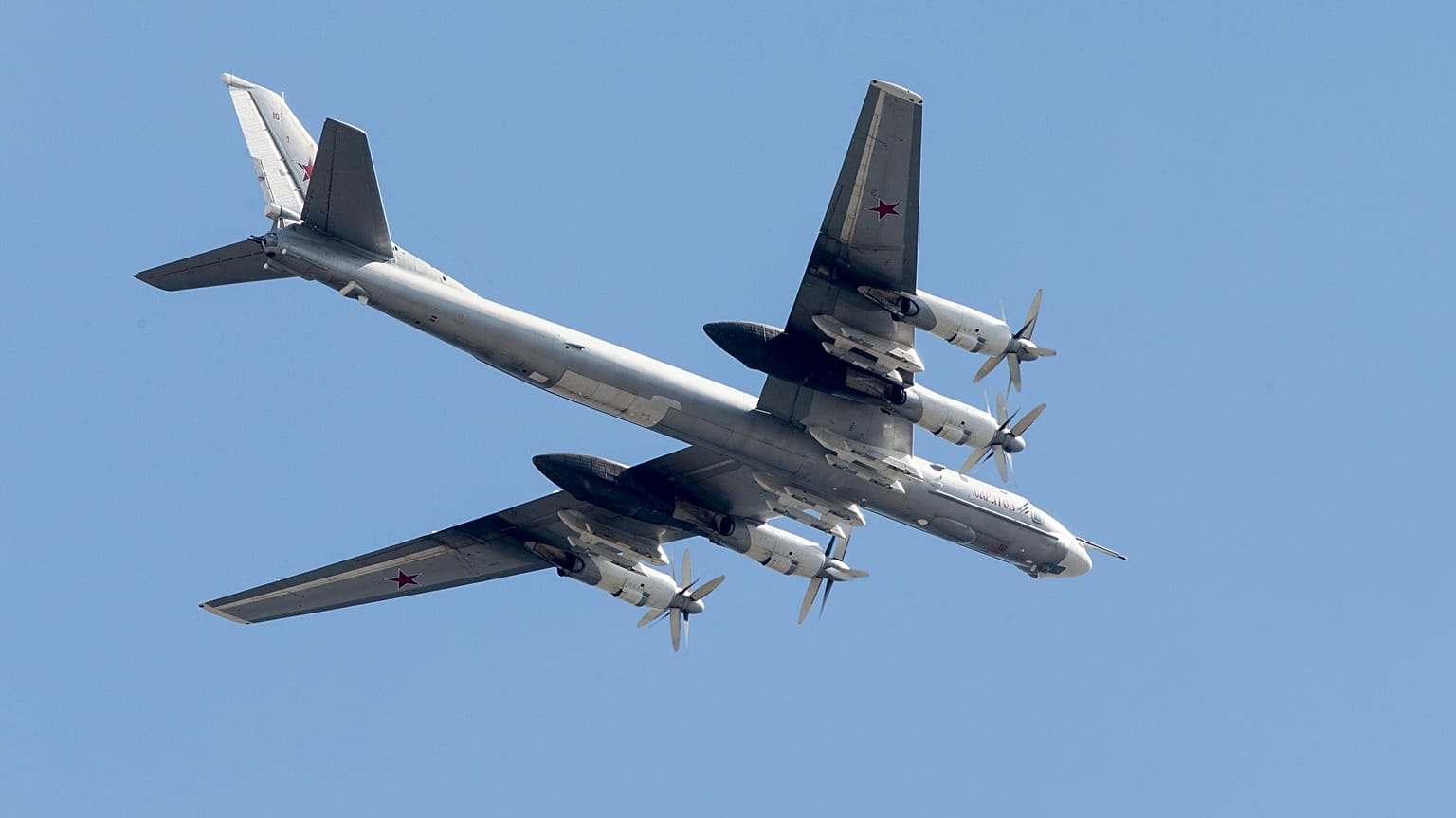 FILE: Russian Tu-95 strategic bomber flies over Red Square during the general rehearsal for the Victory Day military parade, 7 May 2015
