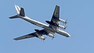 FILE: Russian Tu-95 strategic bomber flies over Red Square during the general rehearsal for the Victory Day military parade, 7 May 2015