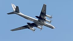 FILE: Russian Tu-95 strategic bomber flies over Red Square during the general rehearsal for the Victory Day military parade, 7 May 2015