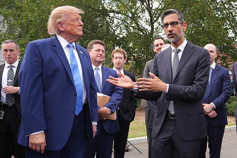 President Trump listens after meeting with top executives of AI firms as Google CEO Sundar Pichai speaks to reporters at the White House in Washington, Tuesday Sept. 29, 2026