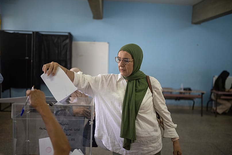 A woman casts her vote inside a polling station during the legislative elections in Rabat, Morocco, Wednesday, Sept. 23, 2026