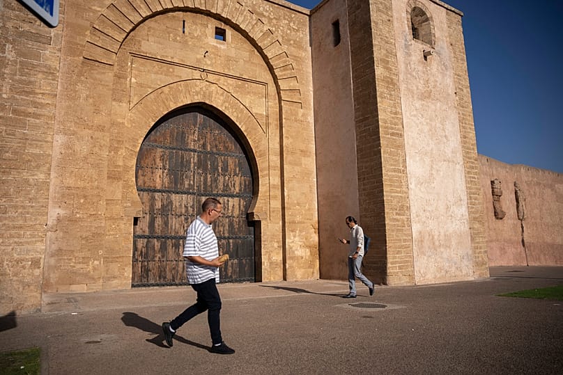 People walk next to the walls of the old Medina on Rabat, Morocco, Wednesday, Sept. 23, 2026