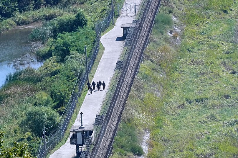 South Korean army soldiers patrol along the barbed-wire fence near the border with North Korea in Paju, 29 September, 2026