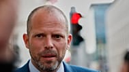 Belgium's Defense Minister Theo Francken speaks with the media as he arrives for a meeting of the National Security Council in Brussels, after recent drone sightings in Belgiu