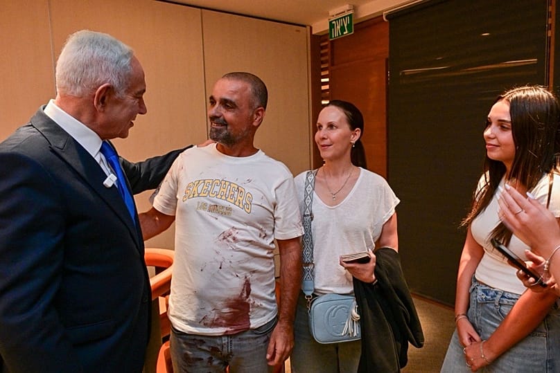 Israeli PM Benjamin Netanyahu with Yaniv Hayun, a flydubai passenger who helped restrain the pilot who had stabbed his fellow pilot on an Israel-bound flight on 30 Sep 2026,