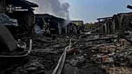 Rescuers put out a fire affecting garages destroyed after a Russian drone strike on Kyiv region, 30 September, 2026