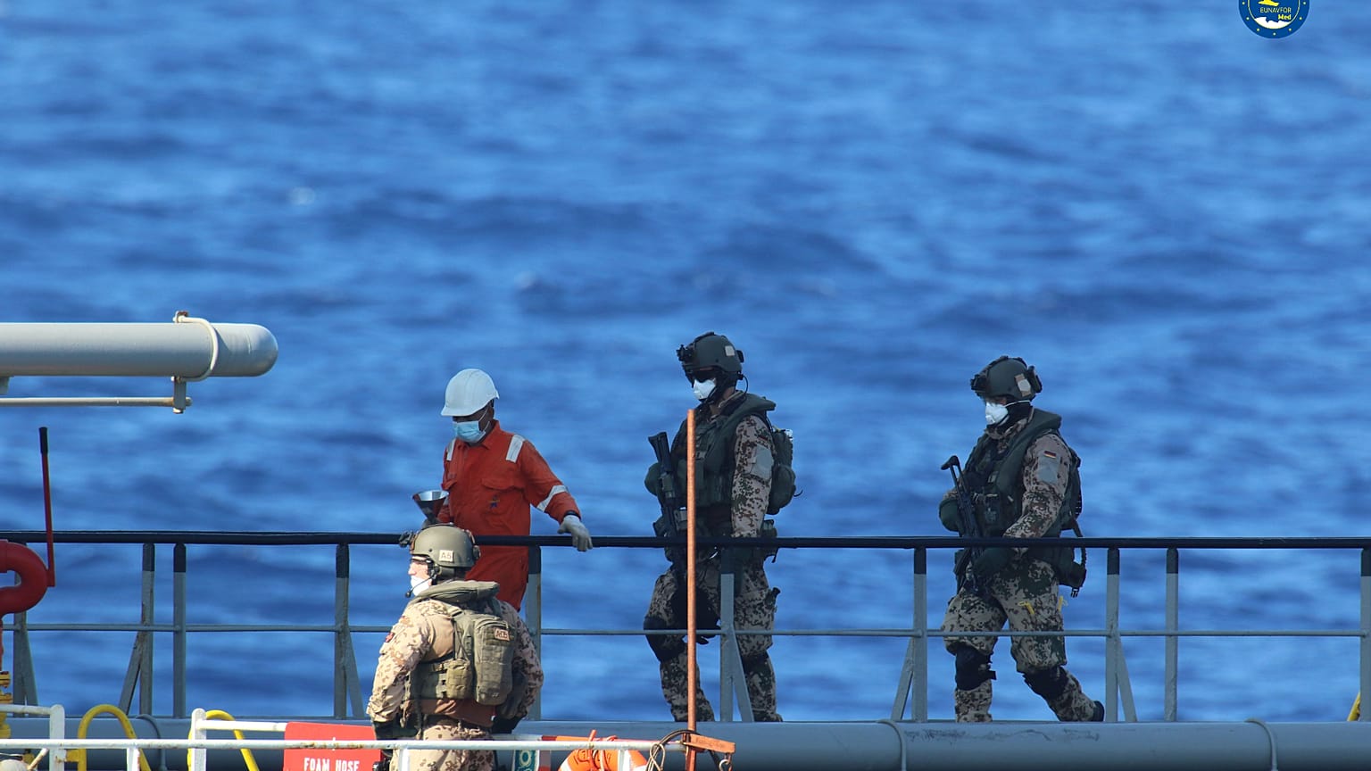 A boarding team inspects the Merchant Vessel Royal Diamond 7, in international waters, 150 kilometers north of the Libyan city of Derna.