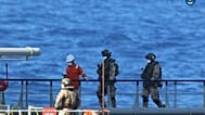 A boarding team inspects the Merchant Vessel Royal Diamond 7, in international waters, 150 kilometers north of the Libyan city of Derna.